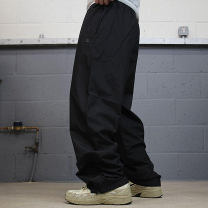 Champion baggy tracksuit bottoms wide leg black Mesh lined embroidered logo gym wear track pants