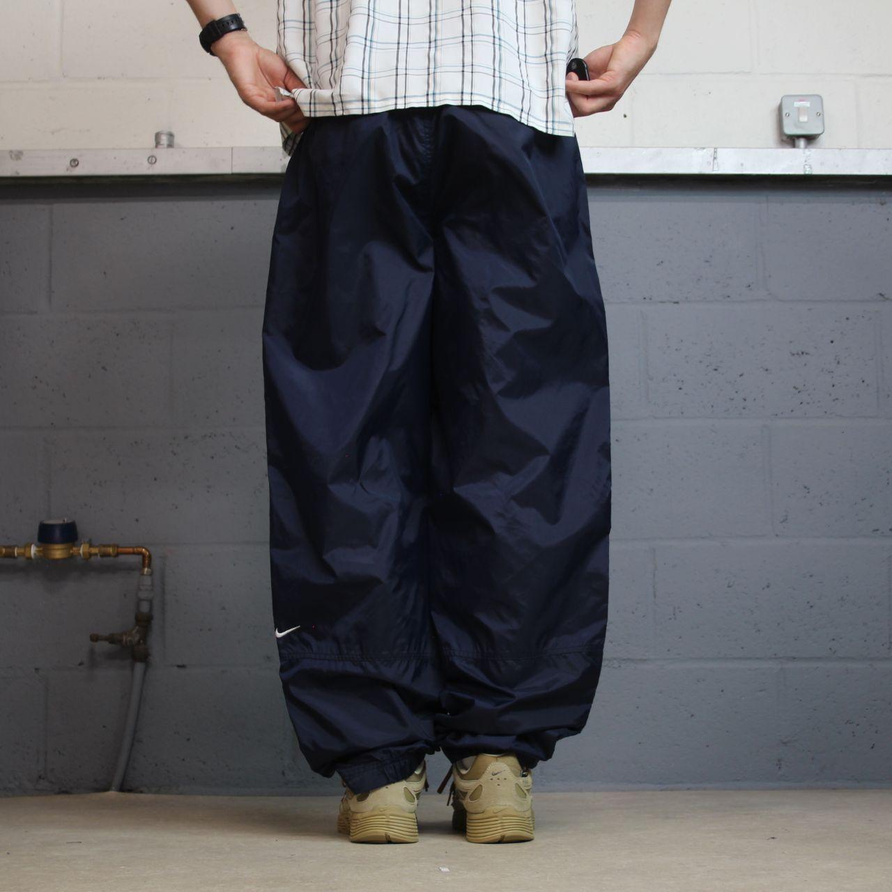 Vintage Nike tracksuit bottoms Y2K navy Loose leg unlined embroidered swoosh track pants
