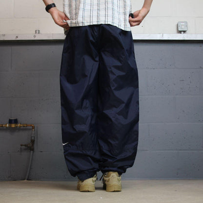 Vintage Nike tracksuit bottoms Y2K navy Loose leg unlined embroidered swoosh track pants