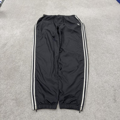 Vintage Adidas tracksuit bottoms loose black Loose floaty embroidered side stripe track pants