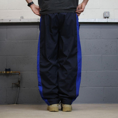 Y2K FILA tracksuit bottoms navy Loose embroidered lined side stripe track pants