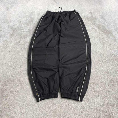 Reebok tracksuit bottoms Y2K black Loose unlined lightweight side stripe track pants