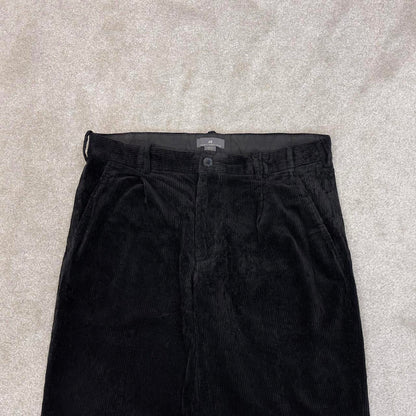 Black H&M wide wale corduroy trousers W32L30 loose pleated jumbo cord pants 90s skate style