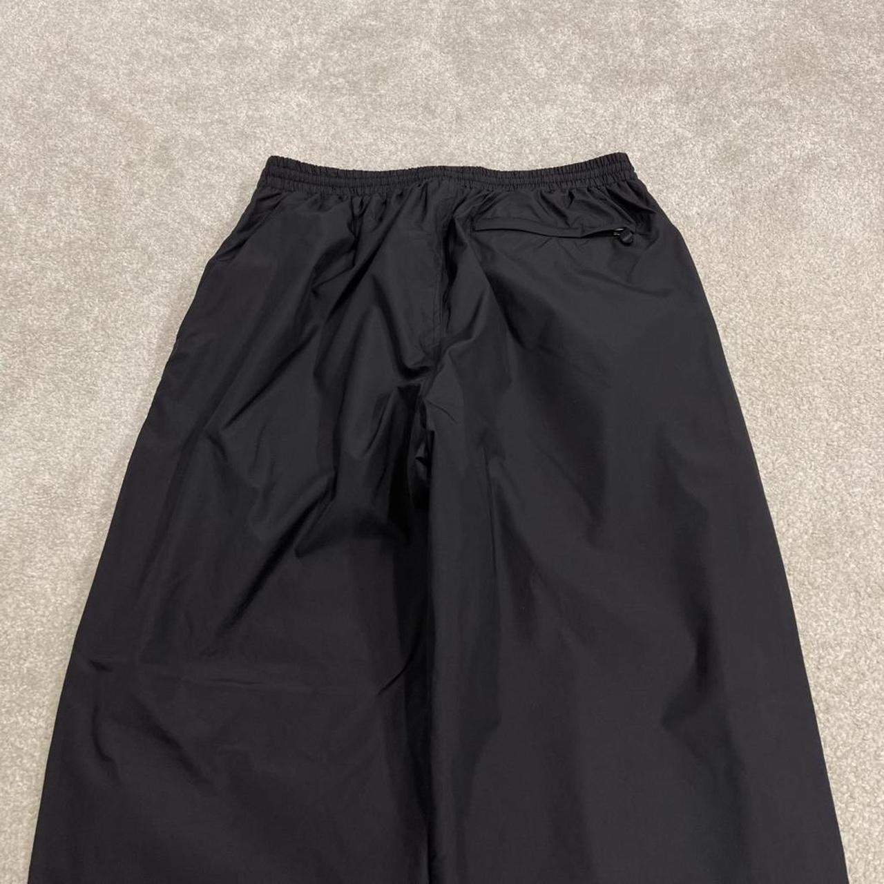 Champion baggy tracksuit bottoms wide leg black Mesh lined embroidered logo gym wear track pants