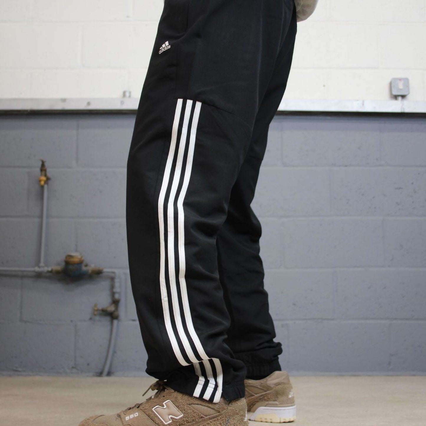 Black Adidas trackies Large y2k loose style sportswear track pants embroidered side stripe design