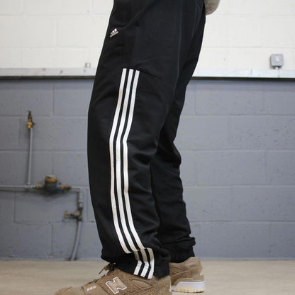 Black Adidas trackies Large y2k loose style sportswear track pants embroidered side stripe design