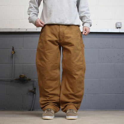 Vintage baggy Carhartt carpenter jeans tan 90s skater style W34L32 flannel lined carpenters