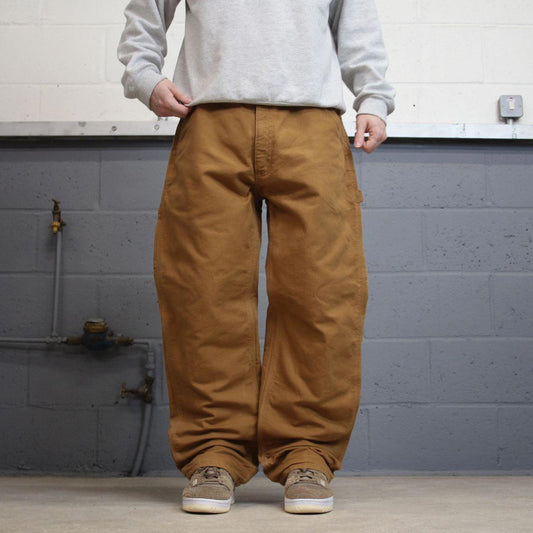 Vintage baggy Carhartt carpenter jeans tan 90s skater style W34L32 flannel lined carpenters