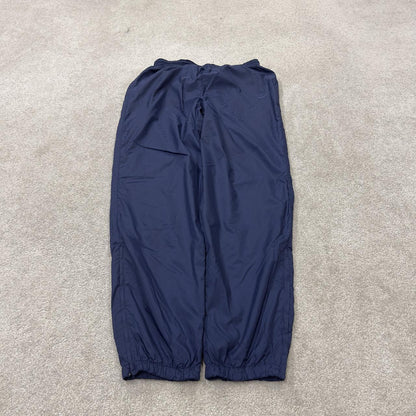 Y2K vintage Nike baggy tracksuit bottoms navy Loose leg 2000s style casual swoosh logo track pants