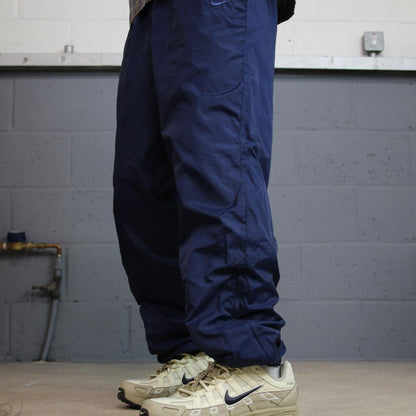 Y2K vintage Nike baggy tracksuit bottoms navy Loose leg 2000s style casual swoosh logo track pants