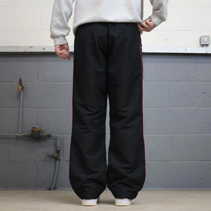 Vintage Womens black Reebok joggers 14 y2k style sportswear track pants side stripe design