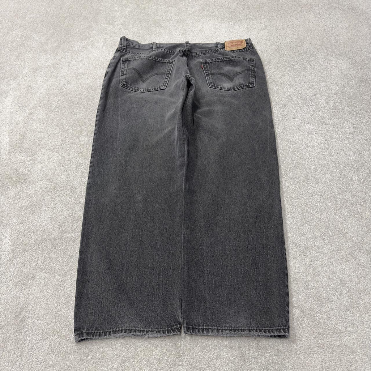 Levi’s 550 jeans Y2K relaxed fit denim faded black Levi’s loose leg 2000s style pants red tab logo