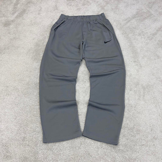 Nike Trackies Large Grey y2k 00s style loose leg Dri-Fit joggers print Swoosh logo