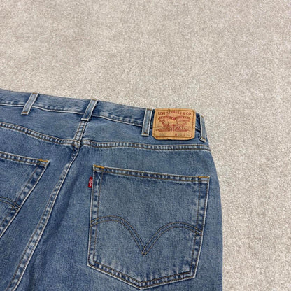 Vintage Y2K Levi’s 550 jeans blue W38L30 Loose straight leg 00s style denim pants red tab logo
