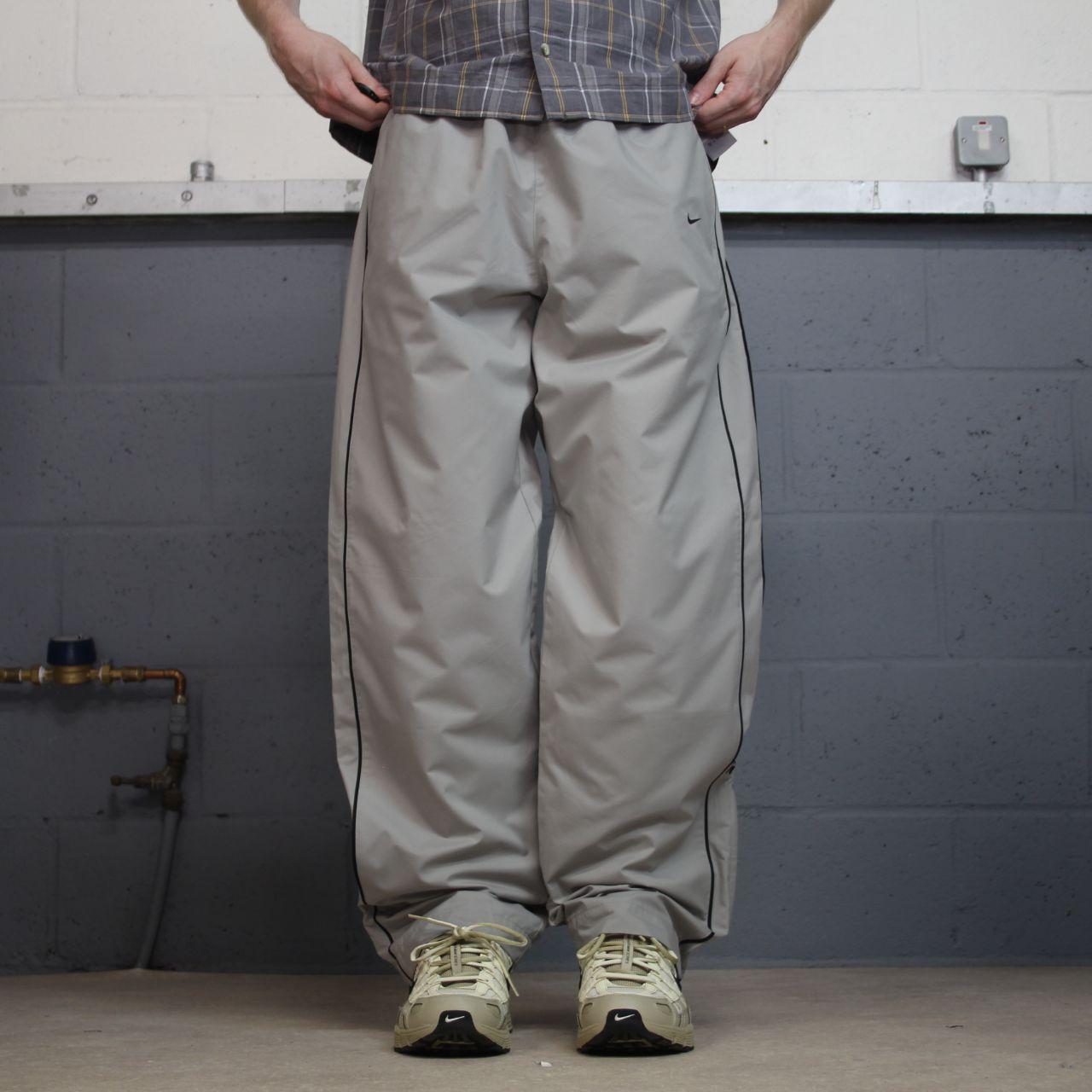 Vintage Nike baggy tracksuit bottoms Y2K grey Wide leg lined embroidered side stripe track pants
