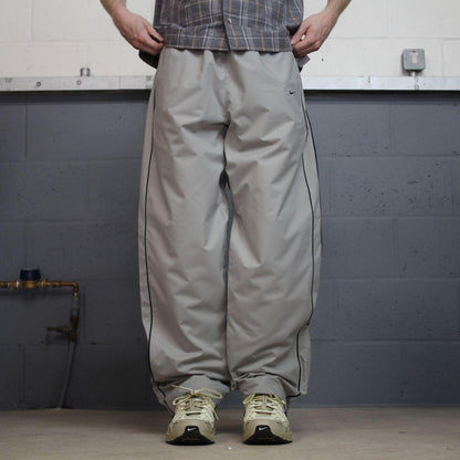 Vintage Nike baggy tracksuit bottoms Y2K grey Wide leg lined embroidered side stripe track pants