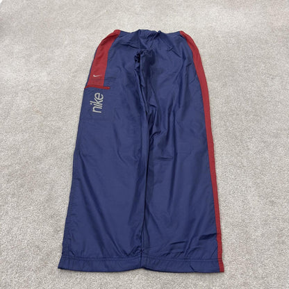 Y2K vintage Nike baggy tracksuit bottoms navy Loose leg 2000s style casual swoosh logo track pants