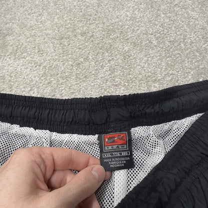 Nike extra baggy tracksuit bottoms wide leg black Nike Team lined embroidered stripe track pants