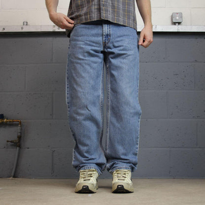 Levi’s 550 jeans Y2K blue relaxed denim Levi’s loose leg 2000s style pants red tab logo