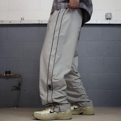 Vintage Nike baggy tracksuit bottoms Y2K grey Wide leg lined embroidered side stripe track pants