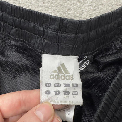 Adidas tracksuit bottoms loose black Loose floaty leg embroidered side stripe track pants