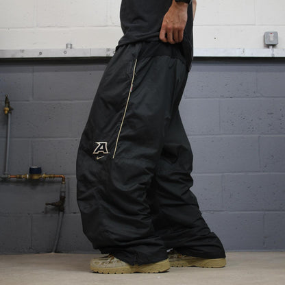 Nike baggy tracksuit bottoms wide leg charcoal Storm-Fit lined embroidered cuffable track pants