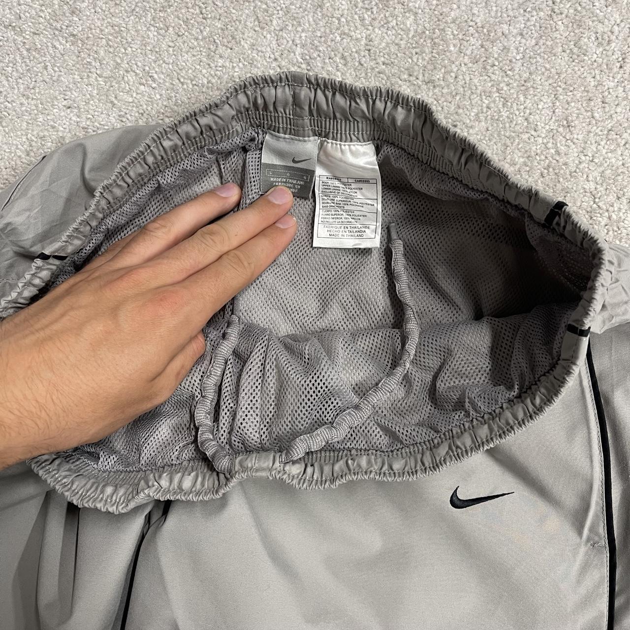 Vintage Nike baggy tracksuit bottoms Y2K grey Wide leg lined embroidered side stripe track pants