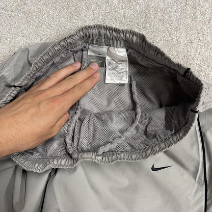 Vintage Nike baggy tracksuit bottoms Y2K grey Wide leg lined embroidered side stripe track pants