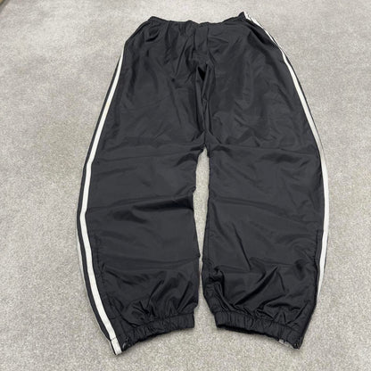 Black Adidas tracksuit bottoms Large y2k style sportswear track pants side stripe design