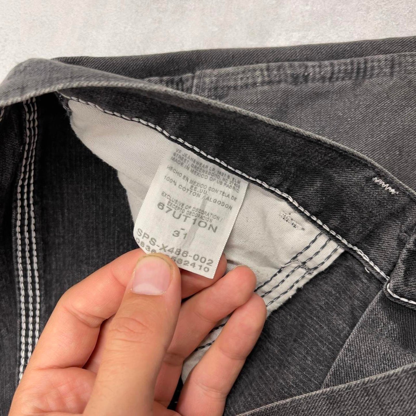 Black Wrangler carpenter jorts W31