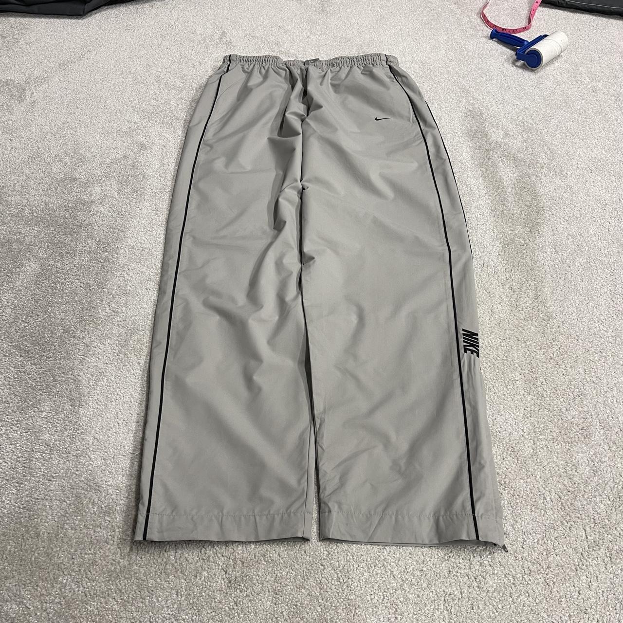Vintage Nike baggy tracksuit bottoms Y2K grey Wide leg lined embroidered side stripe track pants