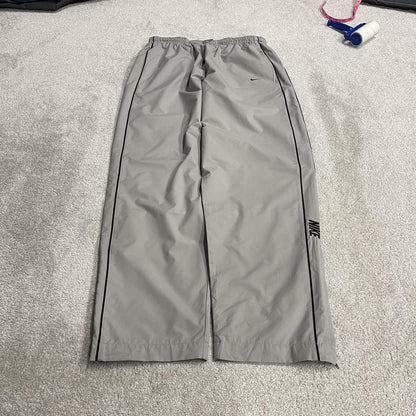 Vintage Nike baggy tracksuit bottoms Y2K grey Wide leg lined embroidered side stripe track pants