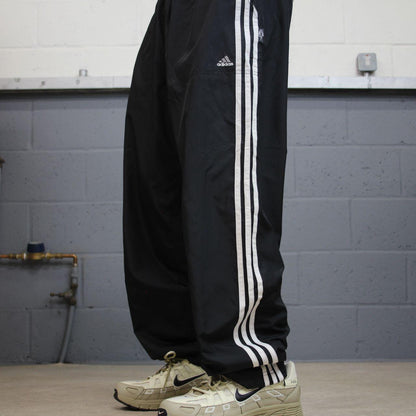 Vintage Adidas tracksuit bottoms loose black Loose floaty embroidered side stripe track pants