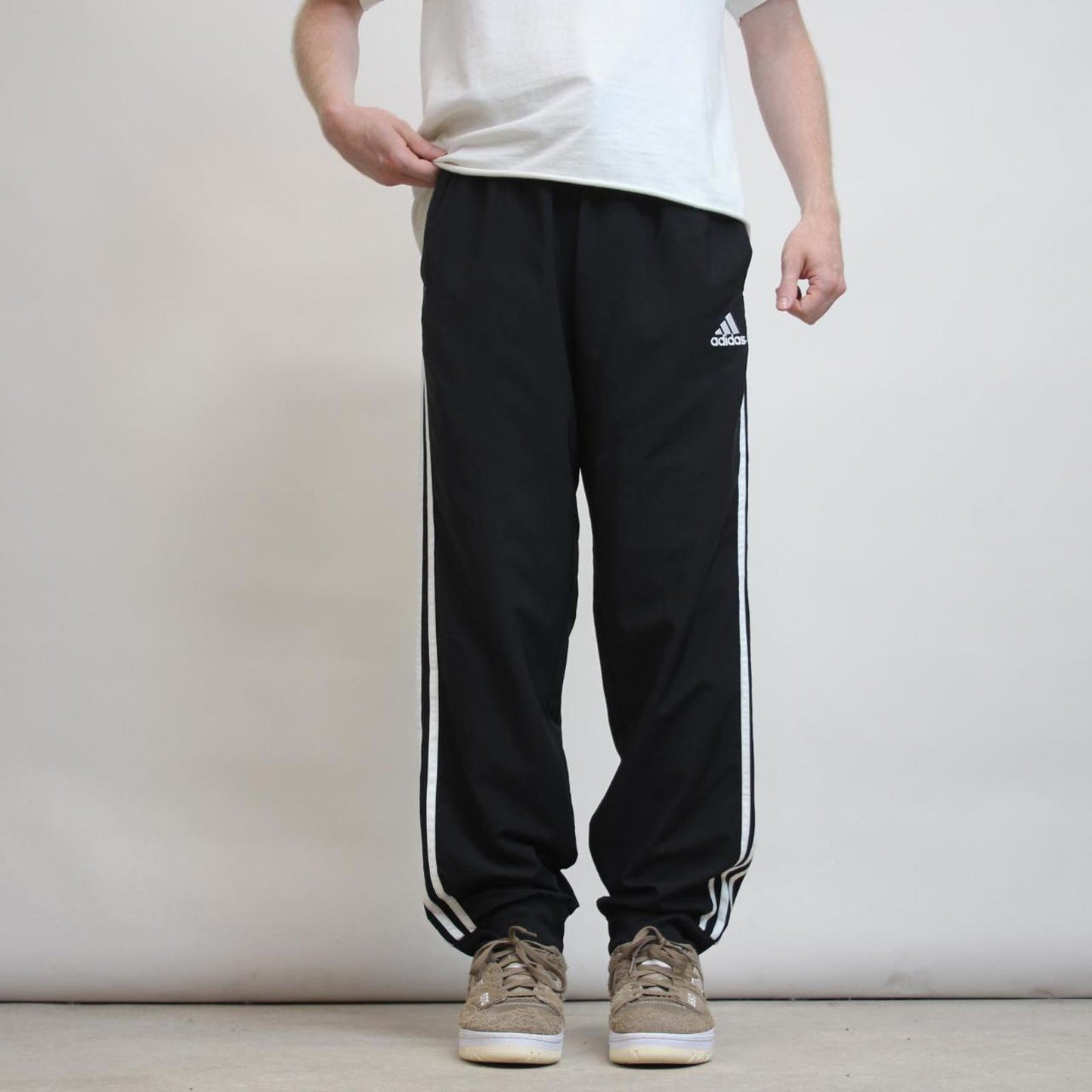 Adidas Trackies L black y2k track bottoms embroidered logo side stripe design