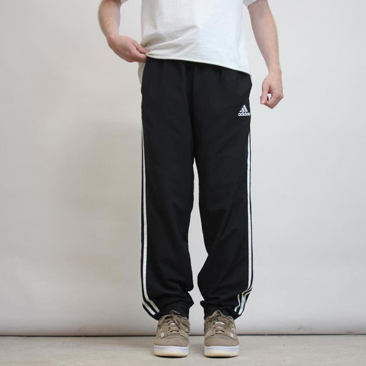 Adidas Trackies L black y2k track bottoms embroidered logo side stripe design