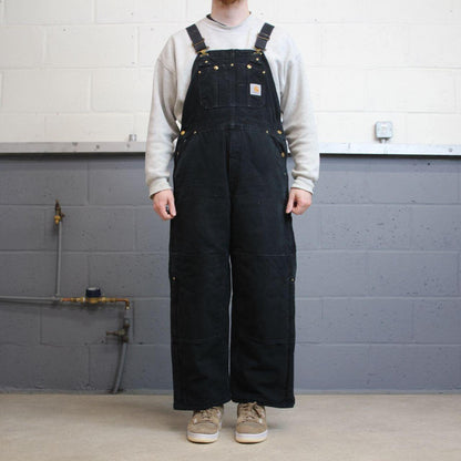Vintage y2k Carhartt dungarees loose leg faded black Canvas quilt lined bib & brace overalls