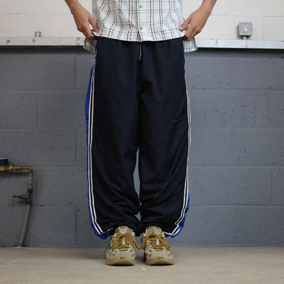 Baggy Y2K Champion tracksuit bottoms navy Loose leg lined 2000s style casual track pants