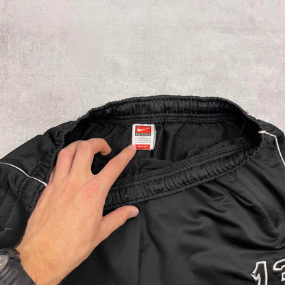 Black Nike trackies M 8-10 loose y2k floaty leg joggers embroidered logo