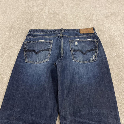 Y2K Guess bootcut jeans W33L34 blue ripped denim Loose bootcut pants with stitch design and pockets