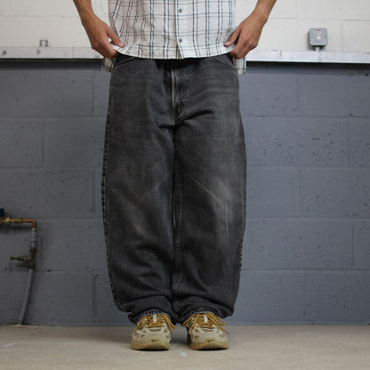 Levi’s 550 jeans Y2K relaxed fit denim faded black Levi’s loose leg 2000s style pants red tab logo