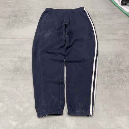 Vintage navy Adidas joggers M y2k style sportswear track pants side stripe design