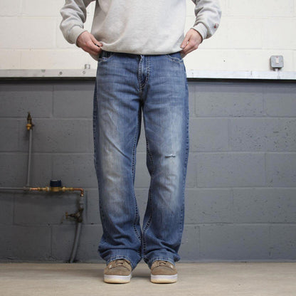 Y2k embroidered Axel bootcut jeans W38L32 blue denim stitched 00s skate style pants