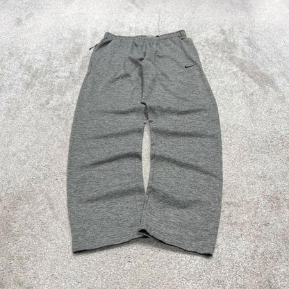 Y2K Nike loose sweatpants joggers grey Swoosh logo fleece lined gym drawstring track pants
