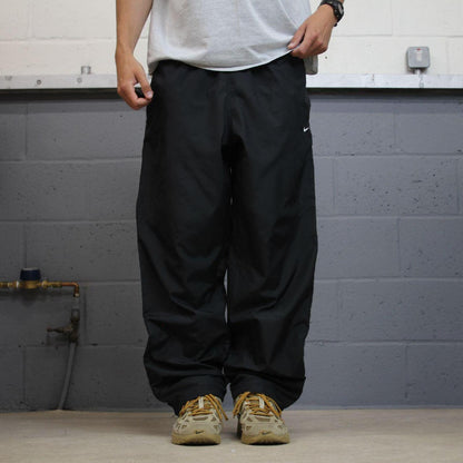 Nike tracksuit bottoms Y2K black Loose fit mesh lined embroidered side stripe track pants