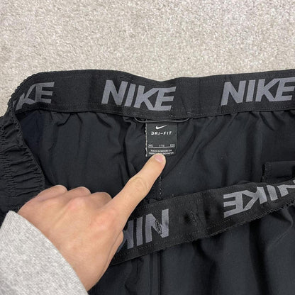 Nike tracksuit bottoms loose fit black Lightweight floaty swoosh logo track pants