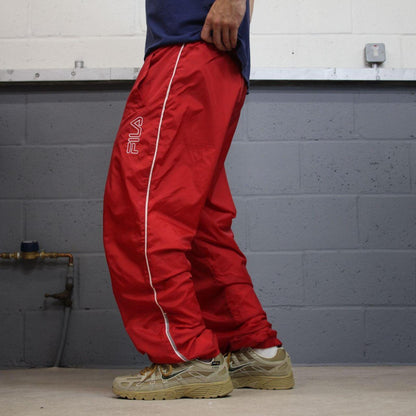 FILA tracksuit bottoms Y2K black Loose fit mesh lined embroidered side stripe track pants
