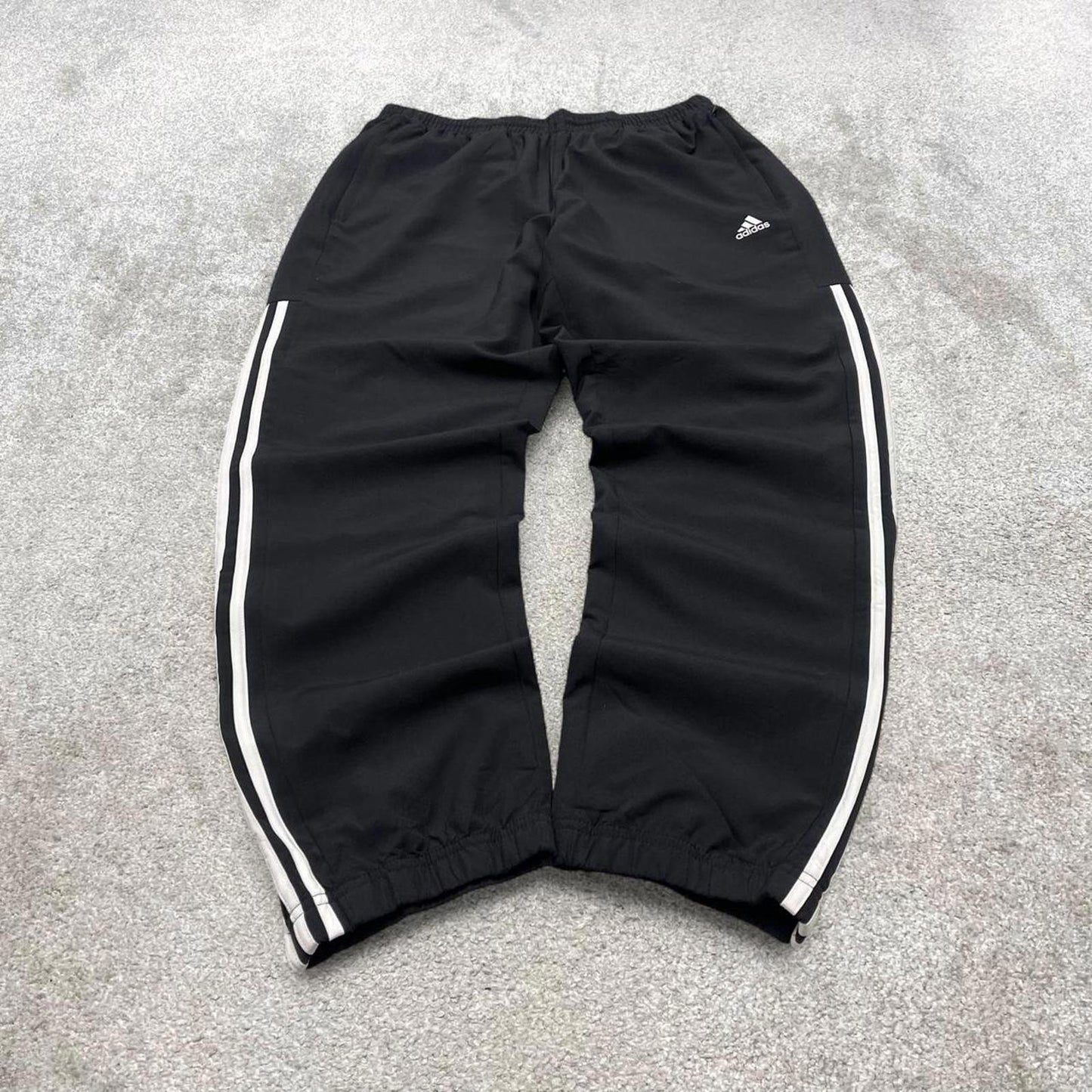 Black Adidas trackies Large y2k loose style sportswear track pants embroidered side stripe design