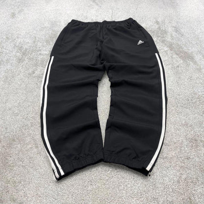 Black Adidas trackies Large y2k loose style sportswear track pants embroidered side stripe design