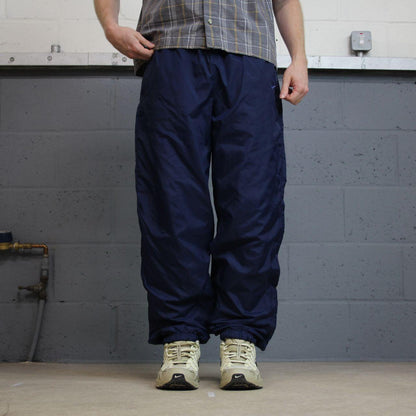 Y2K vintage Nike baggy tracksuit bottoms navy Loose leg 2000s style casual swoosh logo track pants