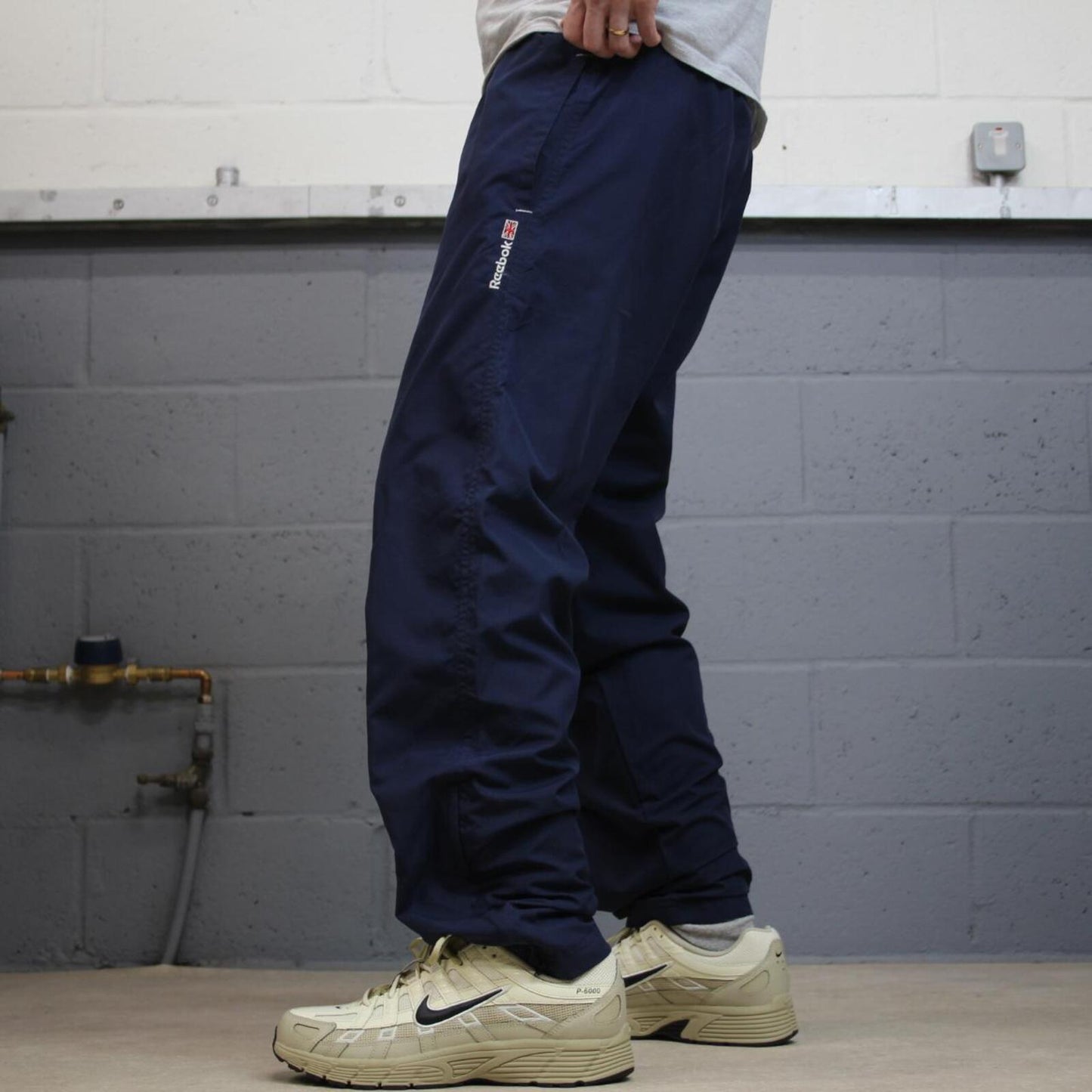 Vintage Reebok tracksuit bottoms loose navy Floaty embroidered mesh lined track pants